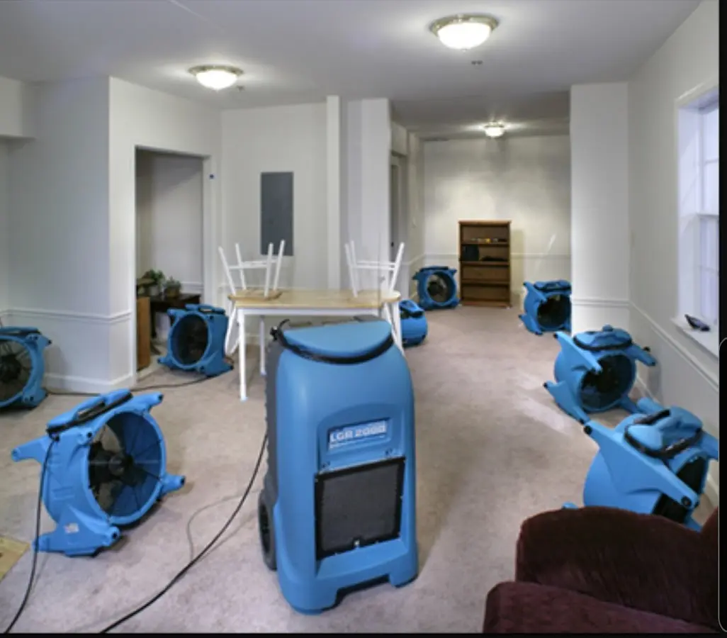 Air movers and dehumidifier setup for Water Damage Restoration in Maywood